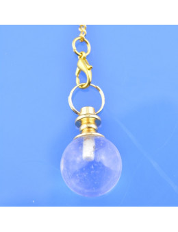 Pendule sphère en pierre et chaîne dorée